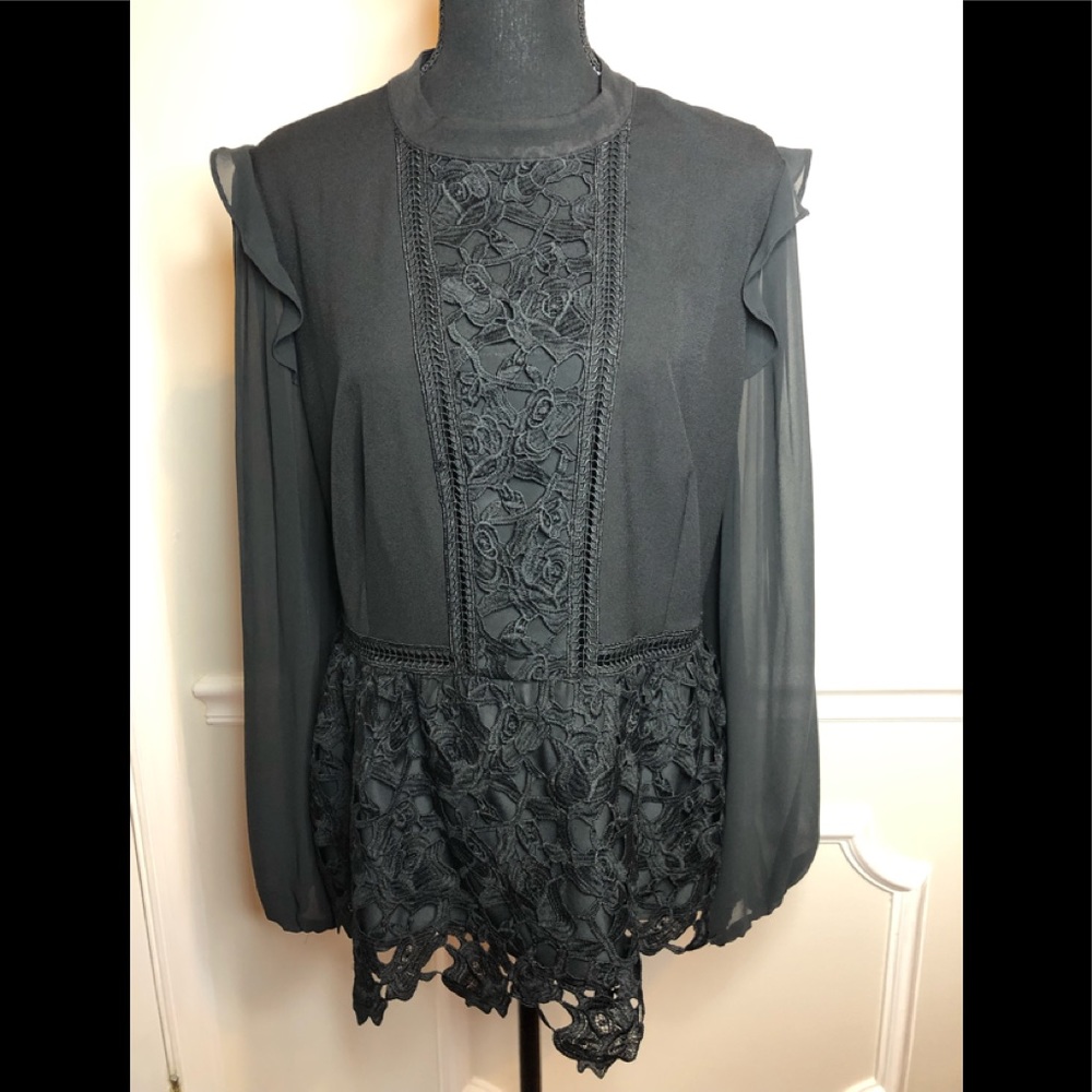 Blouse with lace inset at front and hem